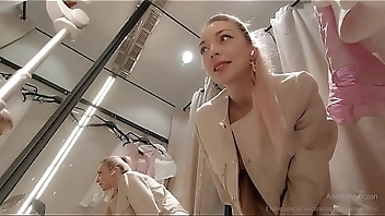 Online date in fitting room with open curtain. Public video call.